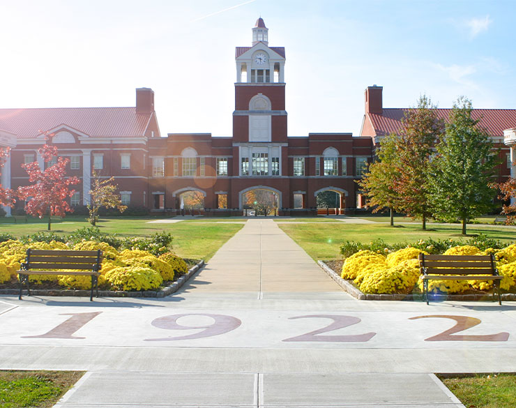 Clock tower with 1922 on concrete