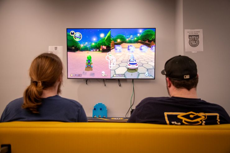Two students playing Mario Kart