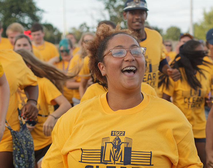 Student smiles at Gold Rush