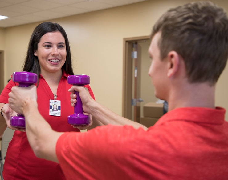 Occupational Therapy student works with a patient