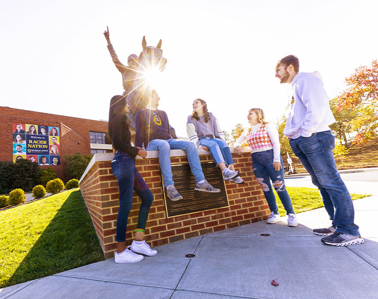 Students at the Racer One statue