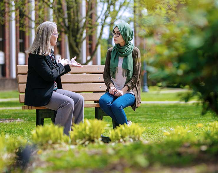 Faculty talks to student