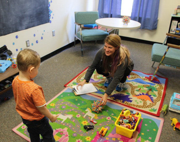 clinician and child in play therapy
