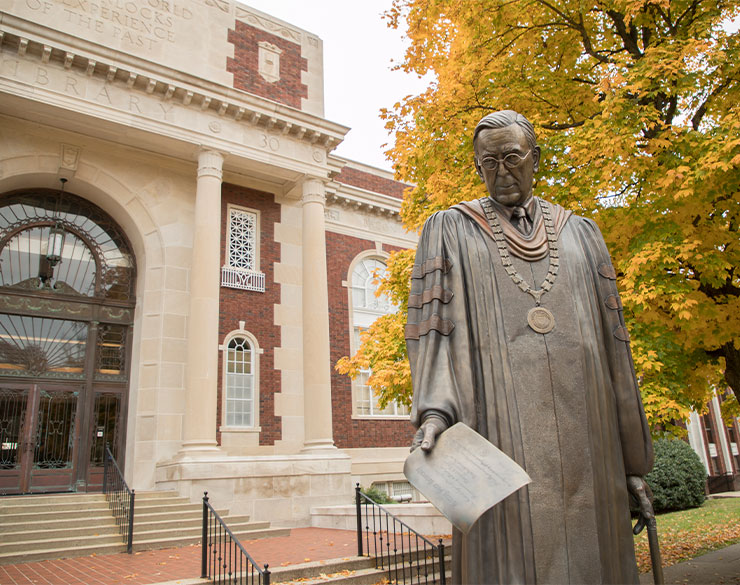 Well statue in fall by Pogue Library