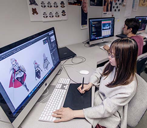 Student uses a graphic design program in computer lab