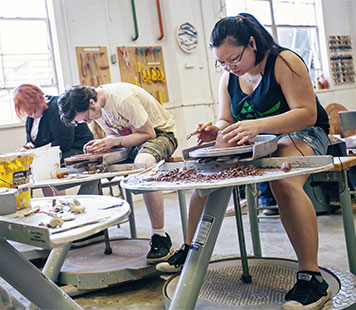 Ceramics students in the studio