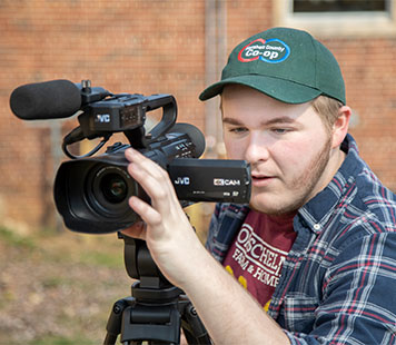 Student with video camera