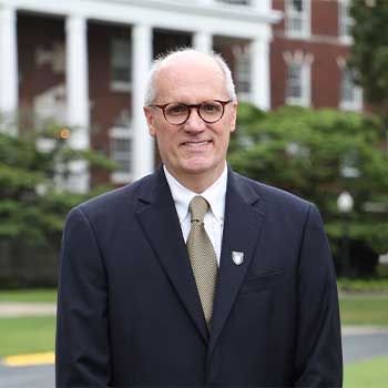 Dr. Bob Jackson in front of Wells Hall