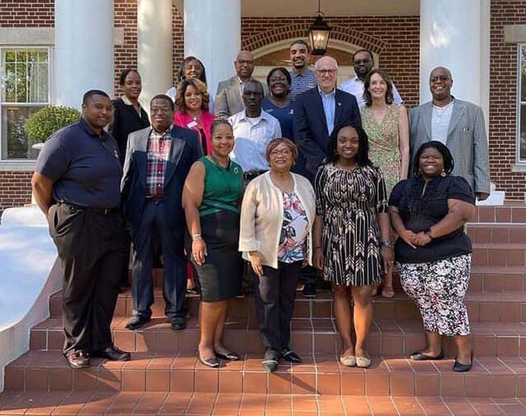 Members of the BFSA pose in front of Oakhurst with Dr. and Karen Jackson