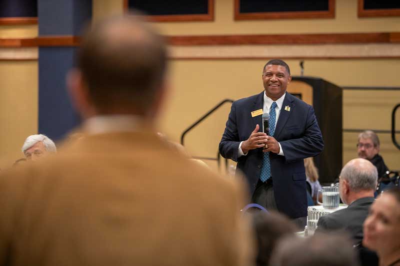 Dr. Ron K. Patterson listens at an assembly.
