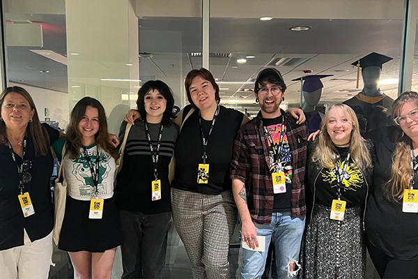 Print Club students pose together at a conference.