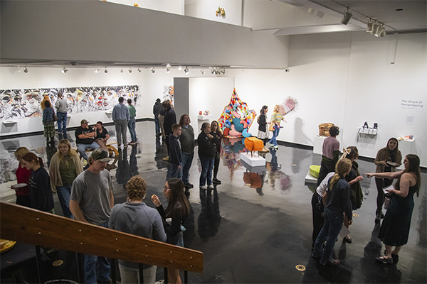 Students, professors, and community members gather in the Clara M. Eagle Gallery for the reception of a new exhibition.
