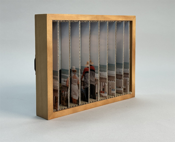 Artwork by student Travis Tan.A photo is cut out and reconstructed within a box, so that the image shifts as you move from one side to the other. 