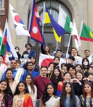International students holding flags.