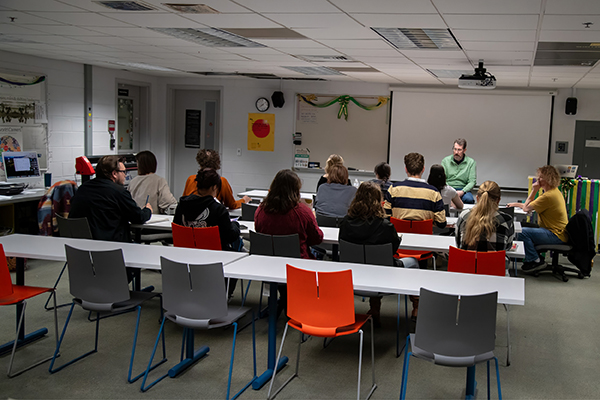 Professor Jim Bryant lectures on graphic design to students.