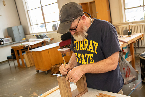 A nontraditional woodworking student builds a box. 