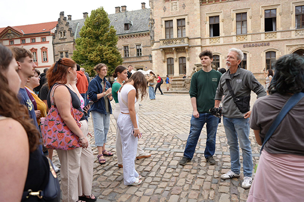 Dr. “ZB” Smetana and art history students tour a European town while studying abroad.