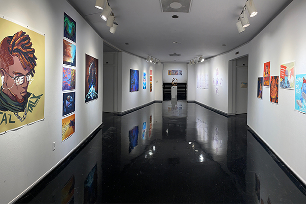 The Mary Ed Mecoy Hall Gallery spans a hallway with art on either side and a display at the end.