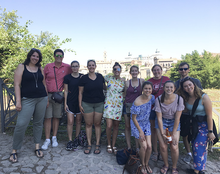 Dr. Antje Gamble poses with a group of art history students studying abroad. 