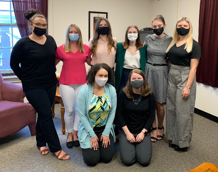 group of clinical graduate students standing together in the clinic