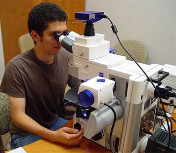 Student with a microscope