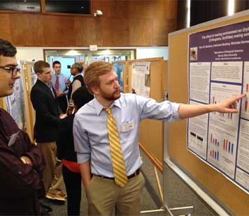 Nic Norman presenting his research.