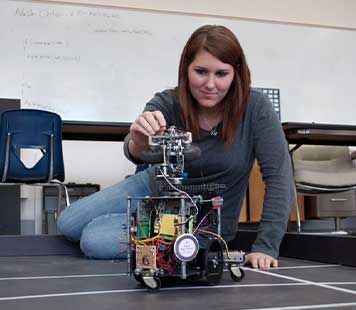 Kristen Garcia with a robot
