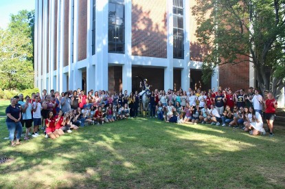 Honors College students pose with Racer One outside of Faculty Hall.