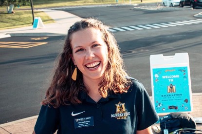 Anna McGreevy welcomes students to campus as a Racer Nation Orientation leader.