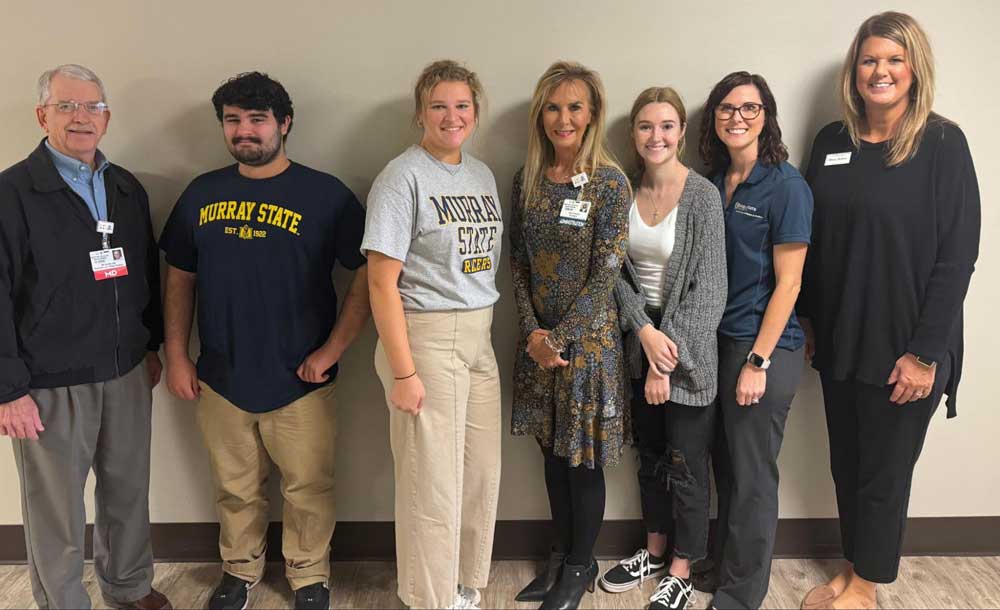 group poses during campus tour