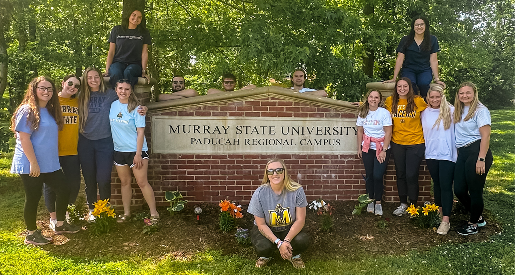 Students pose in front of the MSU Paducah Regional Campus sign