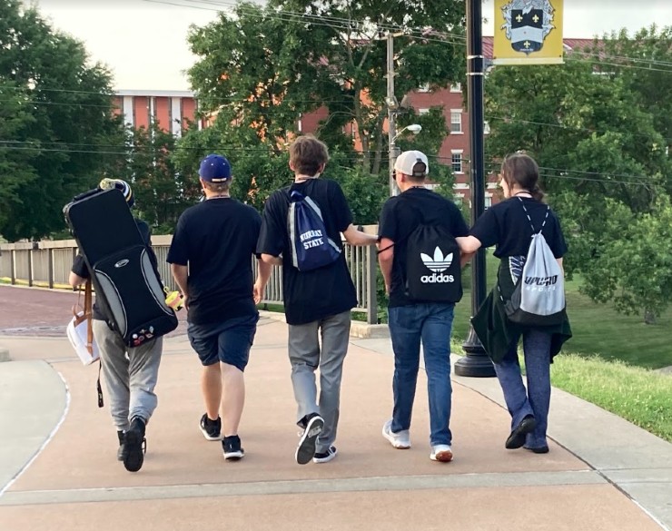 Five campers walking on MSU's campus