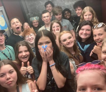Several RIMA campers smiling on an elevator