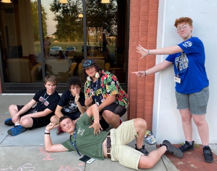 RIMA campers hanging out on the porch of their residence hall, Hester Hall