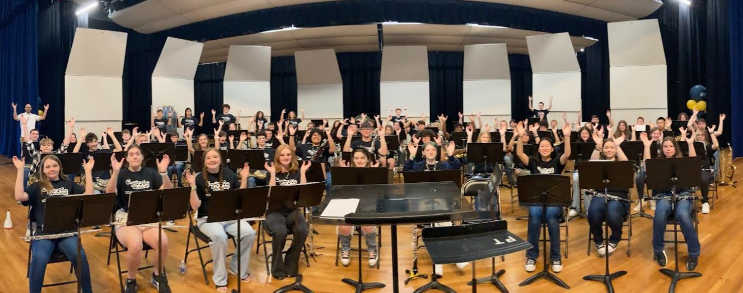 A group of campers perform.