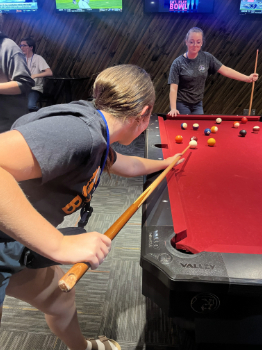 Students playing pool