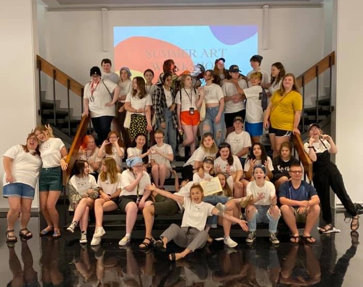 Campers and staff smiling for a group photo