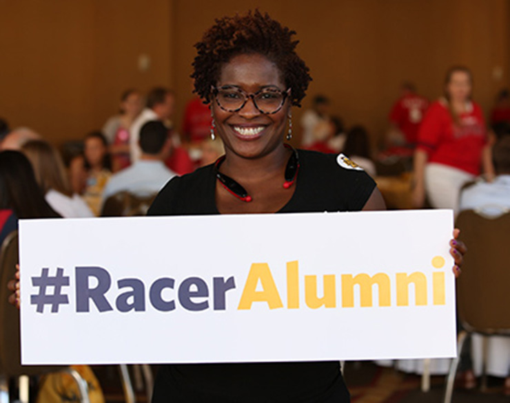 alum holds a sign in St. Louis