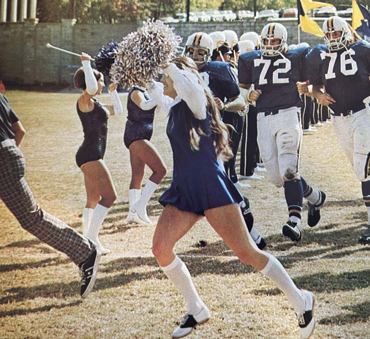 Cheerleaders and football team in 1973