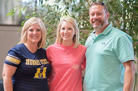 The Hawkinson family poses in the Curris Center