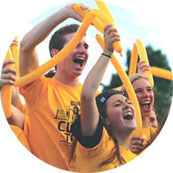 students cheer at football game