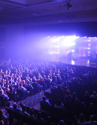 A band performs to a full crowd at Lovett Auditorium.