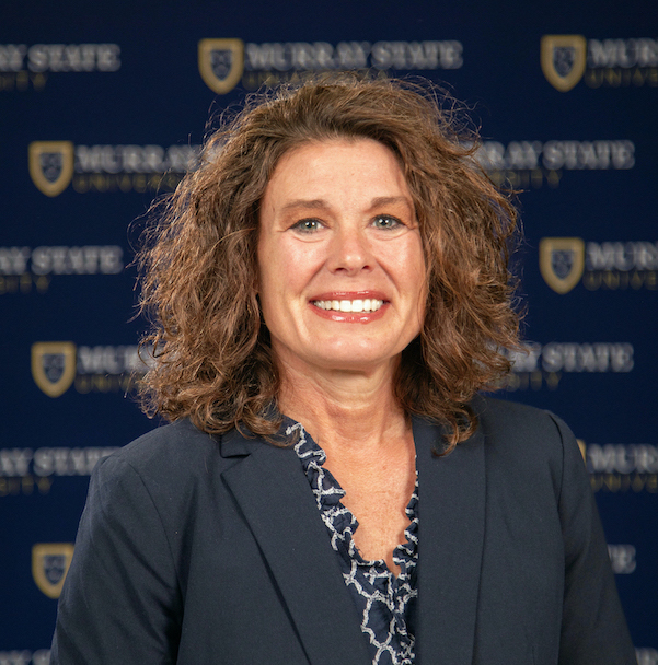 Dean Dr. Dina Byers in front of a Murray State University background.