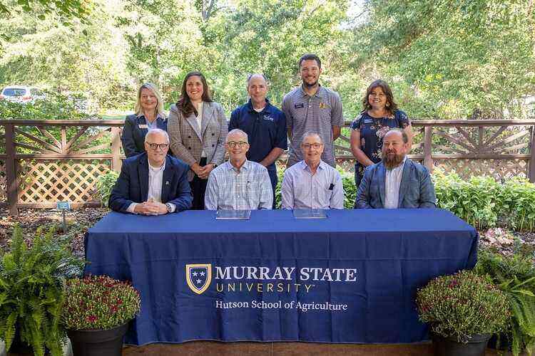 Doran family and MSU signing of guidelines