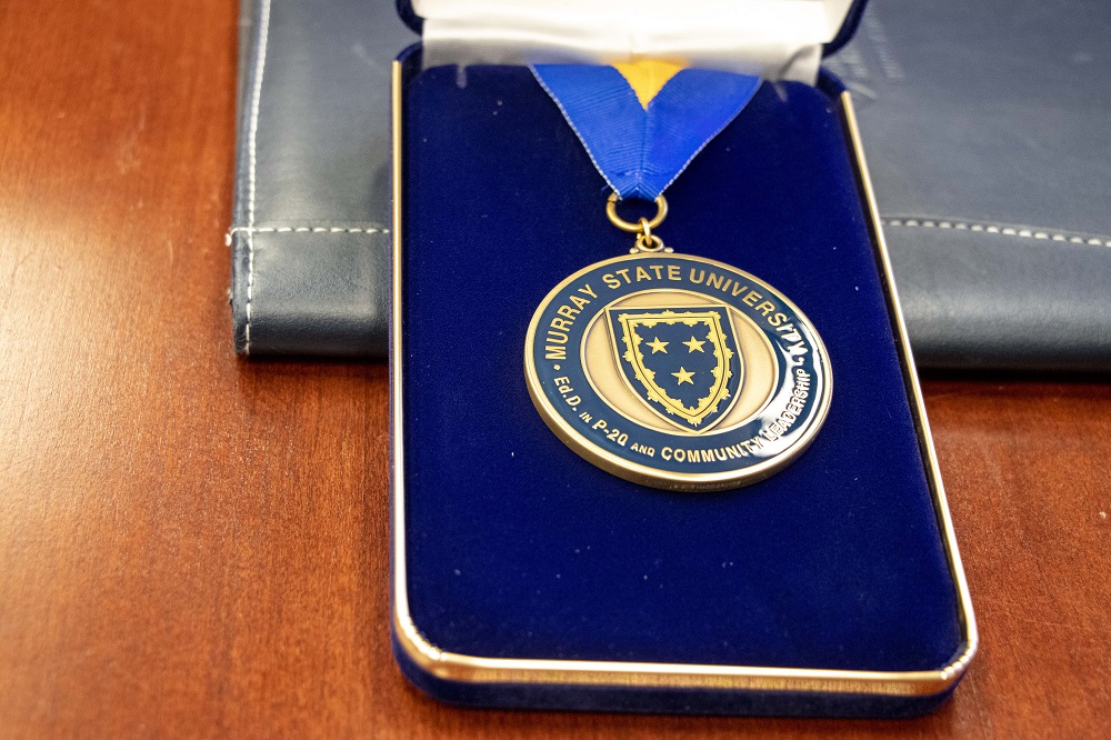 Pictured is a medal received by graduate students at the hooding ceremony