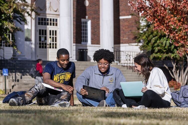 students sitting on campus