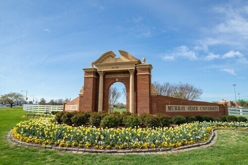 MSU brick arch with flowers