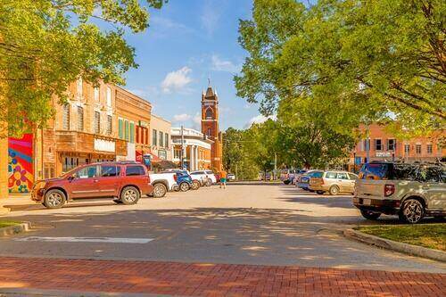 photo of downtown Murray with parked cars