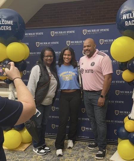 A photo of a family attending the November 2025 Racer Day. 