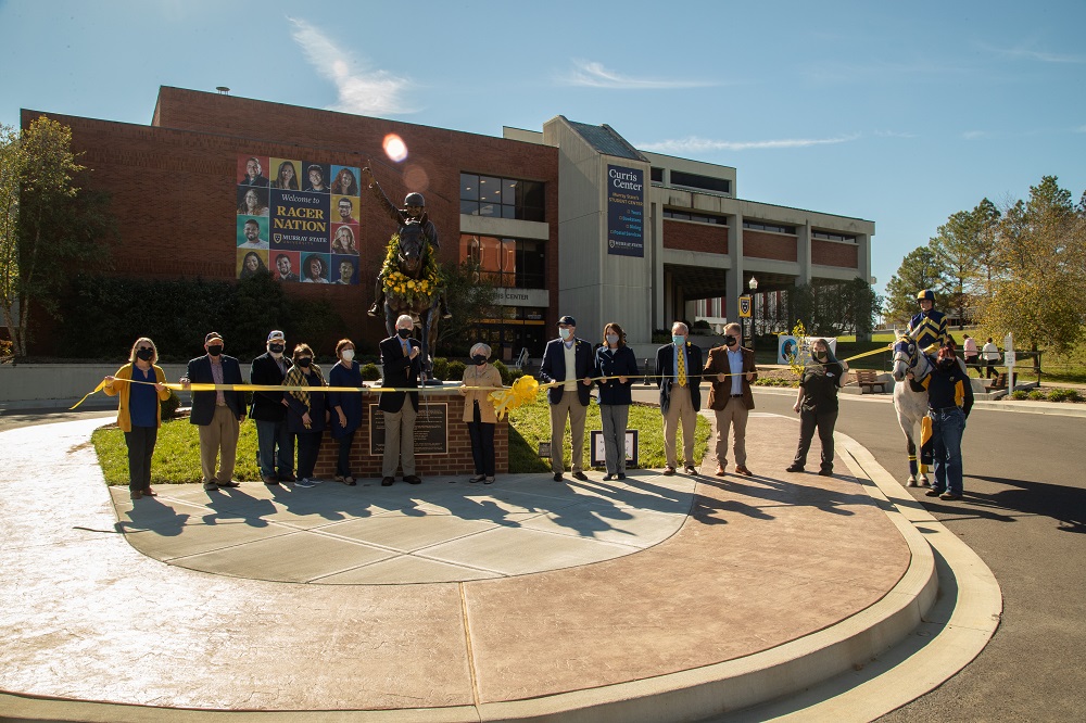 Racer One statue ribboncutting